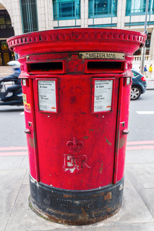 London, UK - June 18, 2016: antique pillar mailbox of the Royal Mail. Royal Mail is a postal service company in the UK, originally established in 1516のeditorial素材