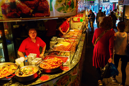 London, UK - June 17, 2016: food stall at Camden Market with unidentified people. It is the fourth-most popular visitor attraction in London, attracting approximately 100,000 people each weekendのeditorial素材