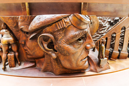 London, UK - June 16, 2016: socket of the statue -The Meeting Place- at St. Pancras Station in London. Its a 9m tall bronze statue of an intimate pose by the world renowned sculptor Paul Day.のeditorial素材