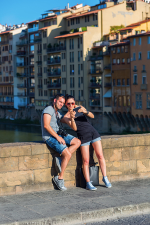 Florence, Italy - July 03, 2016: Ponte Santa Trinita with unidentified people. It is a Renaissance bridge in Florence over the Arno. It is the oldest elliptic arch bridge in the worldのeditorial素材
