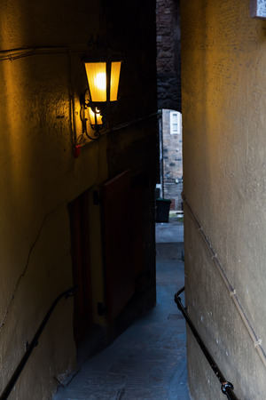 dark close in Edinburgh, Scotland, a narrow alleyway linked to the Royal Mileの写真素材