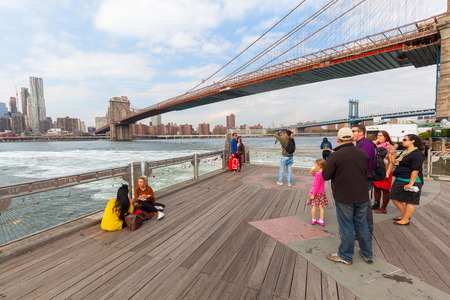 New York City, USA - October 08, 2015: view from Brooklyn over the East River with unidentified people. The metropolitan area NYC is one of the most important economy areas and commercial center of the worldのeditorial素材