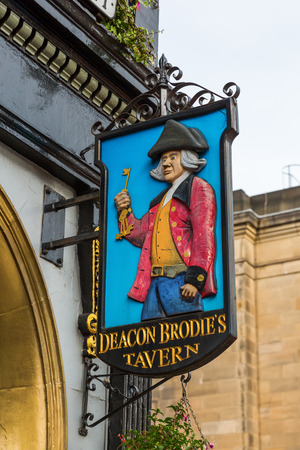 Edinburgh, Scotland - September 12, 2016: Sign at Deacon Brodies Tavern on the Royal Mile. Deacon Brodie was a decent man of business and politics in Edinburgh who had a secret life as a burglarのeditorial素材