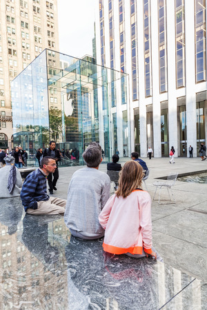 New York City, USA - October 14, 2015: Apple won Numerous architectural awards for store design, particularly for this store on 5th Ave, Midtown, Whose glass cube which designed by Bohlin Cywinski Jacksonのeditorial素材