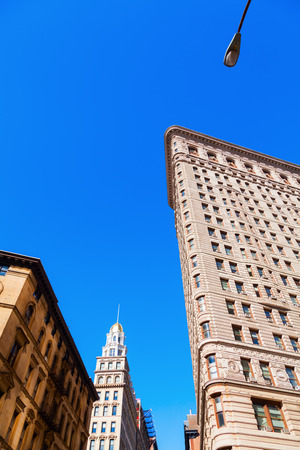 New York City, USA - October 10, 2015: Flatiron Building in Manhattan. Its a teel framed historical skyscraper, designated as NYC landmark and a National Historic Landmark and registered in Historic Placesのeditorial素材