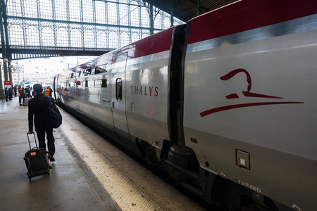 Paris, France - October 21, 2016: Thalys train and unidentified people at the station Gare du Nord in Paris. The Thalys is an European high-speed train with a speed up to 300 km/h.のeditorial素材