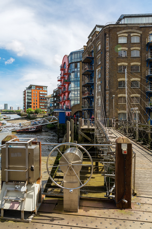 London, UK - June 15, 2016: New Concordia Wharf in Southwark, London. It was formerly a late Victorian grain warehouse, today grade II listed, restored and converted into loft apartmentsのeditorial素材