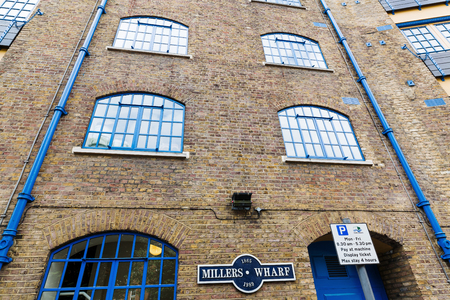 London, UK - June 15, 2016: Millers Wharf at St Katharines docks in London. They were part of the Port of London -now known as the Docklands- and are now a popular housing and leisure complex.のeditorial素材
