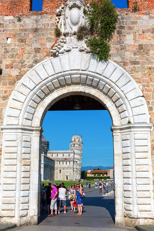 Pisa, Italy - June 30, 2016: historic city gate of Pisa with unidentified people. Pisa is known worldwide for its leaning tower and it has a lot of historic buildings in the city.のeditorial素材