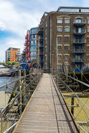 London, UK - June 15, 2016: New Concordia Wharf in Southwark, London. It was formerly a late Victorian grain warehouse, today grade II listed, restored and converted into loft apartmentsのeditorial素材