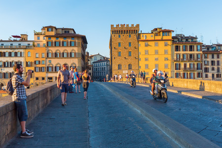 Florence, Italy - July 03, 2016: Ponte Santa Trinita with unidentified people. It is a Renaissance bridge in Florence over the Arno. It is the oldest elliptic arch bridge in the worldのeditorial素材