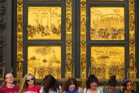Florence, Italy - July 04, 2016: unidentified people in front of the Baptistery portal of the Florence Cathedral. Its part of UNESCO world heritage and a major attraction to tourists visiting Tuscanyのeditorial素材