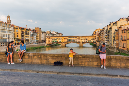 Florence, Italy - July 03, 2016: Ponte Santa Trinita with unidentified people. It is a Renaissance bridge in Florence over the Arno. It is the oldest elliptic arch bridge in the worldのeditorial素材