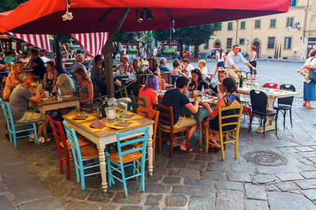 Florence, Italy - July 05, 2016: bar with unidentified people on The Piazza Santo Spirito in Florence. In medieval time Florence was the center of European trade and one of the wealthiest citiesのeditorial素材