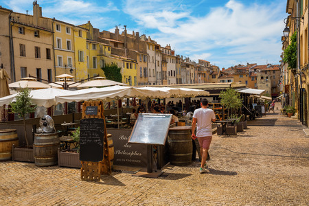 Aix-en-Provence - July 27, 2016: Place des Cardeurs with several cafes and unidentified people in Aix-en-Provence. Aix-en-Provence is University city and the historical capital of the Provence.のeditorial素材