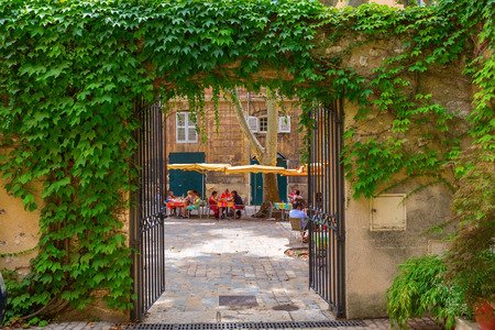 Aix-en-Provence - July 27, 2016: picturesque square with cafes and unidentified people in Aix-en-Provence. Aix-en-Provence is University city and the historical capital of the Provence.のeditorial素材