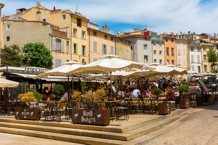 Aix-en-Provence - July 27, 2016: Place des Cardeurs with several cafes and unidentified people in Aix-en-Provence. Aix-en-Provence is University city and the historical capital of the Provence.のeditorial素材