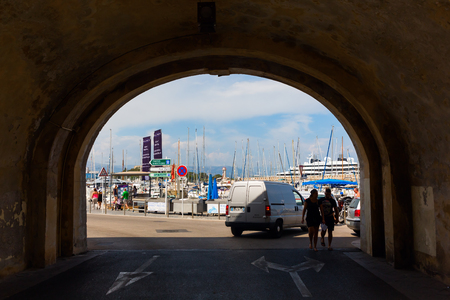 Antibes, France - July 24, 2016: city gate at the historic city wall with unidentified people. Antibes is a Mediterranean resort in Alpes-Maritimes department of southeastern France, on Cote d Azurのeditorial素材