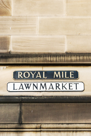 street name signs at a house wall in Edinburgh, Scotland, UKの写真素材