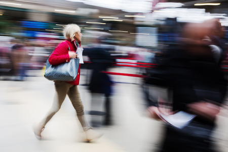 picture with creative motion blur effect of traveling people at the railway stationの写真素材