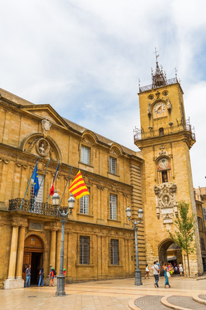 Aix-en-Provence, France - July 27, 2016: historic city hall and clock tower and unidentified people. Aix-en-Provence is University city and the historical capital of the Provence.のeditorial素材