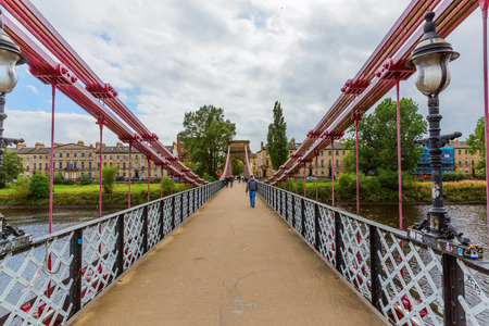 Glasgow, UK - September 12, 2016: South Portland Street Suspension Bridge with unidentified people. The South Portland Street Suspension Bridge is a suspension-type footbridge across the River Clydeのeditorial素材