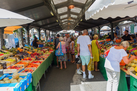 Cannes, France - August 05, 2016: Provencal market in Cannes with unidentified people. Cannes is well known for its association with the rich and famous, and the Cannes Film Festivalのeditorial素材
