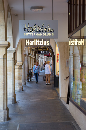 Muenster, Germany - September 25, 2016: shopping arcade in Muenster with unidentified people. Muenster is well known as bicycle city and for the after world war partly restored historical old townのeditorial素材