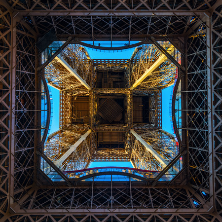 Paris, France - October 16, 2016: look up from one of the platforms of the illuminated Eiffel Tower. The tower is the main landmark of France and the most visited monumentのeditorial素材