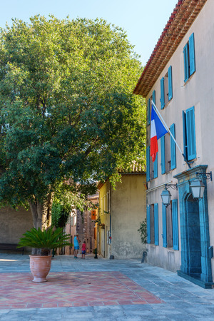 Grimaud, France - August 03, 2016: forecourt of the municipality with unidentified people. Grimaud is a village and commune in the Var department in southeastern Franceのeditorial素材