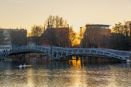 Cologne, Germany - December 30, 2016: lake at Mediapark with unidentified people. The MediaPark accommodate companies of media and communication industry, home to over 250 companies and of 5000 peopleのeditorial素材