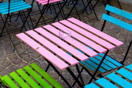 old and colorful coffee tables and chairsの写真素材