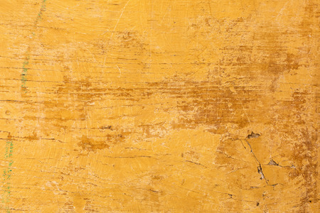 background texture of weathered and cracked painted woodの写真素材