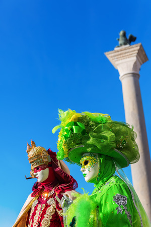 picture of two persons with carnivals masks in Venice, Italyの写真素材