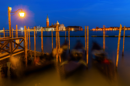 picture of gondolas in Venice, Italy, at nightの写真素材