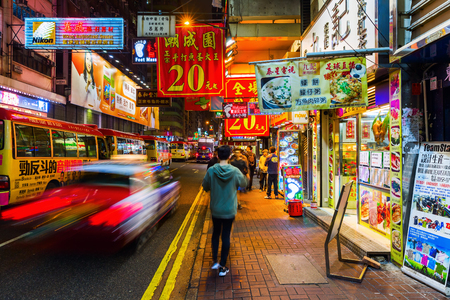 Hong Kong, Hong Kong - March 14, 2017: shopping street with illuminated advertisings and unidentified people at night. Hong Kong ranks as the worlds 4th most densely populated sovereign stateのeditorial素材