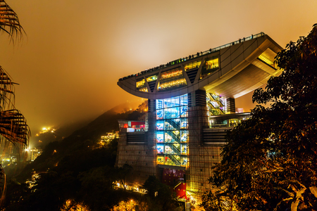 Hong Kong, Hong Kong - March 12, 2017: modern Peak Tower at the Victoria Peak on Hongkong Island at night. The Peak Tower is located at an elevation of 396 m, 156 m below the summit of Victoria Peakのeditorial素材