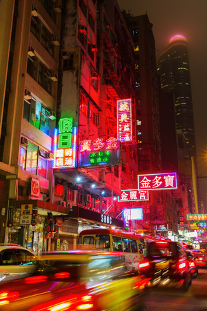 Hong Kong, Hong Kong - March 10, 2017: shopping street with neon signs in Kowloon at night. Hong Kong is one of worlds most significant financial centres, 4th most densely populated stateのeditorial素材