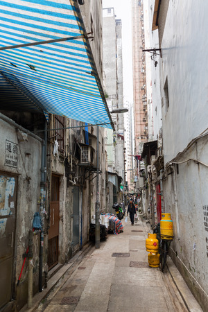 Hong Kong, Hong Kong - March 10, 2017: backstreet in Kowloon, Hong Kong, with unidentified people. Hong Kong is one of worlds most significant financial centres, 4th most densely populated stateのeditorial素材