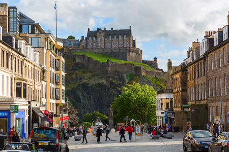 Edinburgh, Scotland - September 10, 2016: street scene with unidentifed people and view to the Edinburgh Castle. Edinburgh is the capital of Scotland, its old and new town are UNESCO listedのeditorial素材