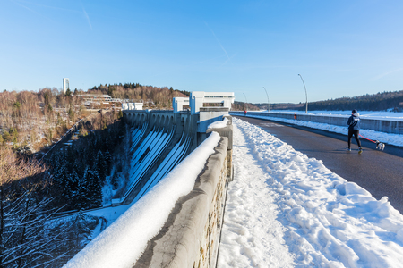 Eupen, Belgium - January 21, 2017: dam of the Lake Eupen with unidentified people. It is an artificial which is created by a dam that was built on the river Vesdre in 1938 but inaugurated only in 1950のeditorial素材