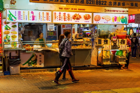 Hong Kong, Hong Kong - March 14, 2017: typical cookshop in Kowloon at night, with unidentified people. HK is one of worlds most significant financial centres and the 4th most densely populated stateのeditorial素材