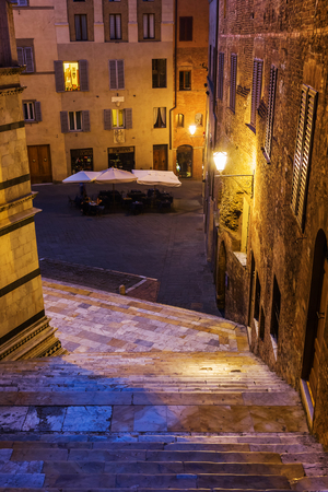 Siena, Italy - July 07, 2016: night scene with unidentified people in Siena. Siena is one of the nations most visited tourist attractions, the old town is declared as UNESCO world heritage siteのeditorial素材