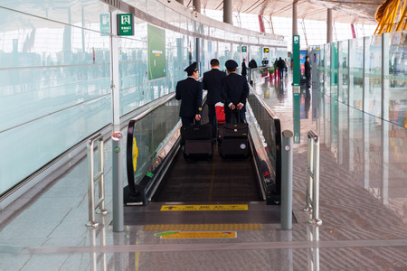 Hong Kong, Hong Kong - March 15, 2017: inside view of HK Airport with unidentified people. In 2015, HKIA handled 68.5 mio passengers, making it the 8th busiest airport worldwide by passenger trafficのeditorial素材