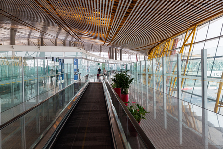 Hong Kong, Hong Kong - March 15, 2017: inside view of HK Airport with unidentified people. In 2015, HKIA handled 68.5 mio passengers, making it the 8th busiest airport worldwide by passenger trafficのeditorial素材