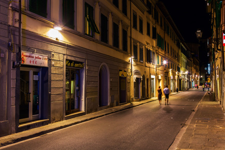 Florence, Italy - July 03, 2016: street scene in the old town of Florence with unidentified people at night. In medieval time Florence was the center of European trade and one of the wealthiest citiesのeditorial素材
