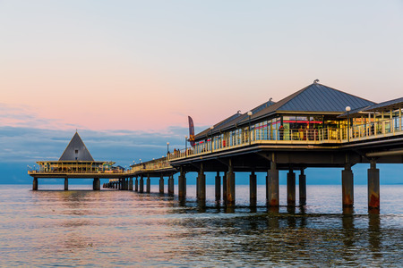 Heringsdorf, Germany - October 23, 2017: Heringsdorf Pier at sunset on the Baltic Sea island Usedom. It is with 508 m the longest German pier. It houses a museum, cinema, restaurant and many moreのeditorial素材