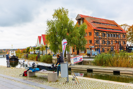 Wolgast, Germany - October 23, 2017: city harbor of Wolgast with unidentified people. Wolgast is also called the Gate to Usedom. It has well preserved historic buildings in the old townのeditorial素材