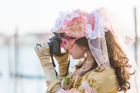 Venice, Italy - February 26, 2017: unidentified disguised woman at the Carnival of Venice. The Carnival of Venice is an annual festival, world famous for its elaborate masks.のeditorial素材