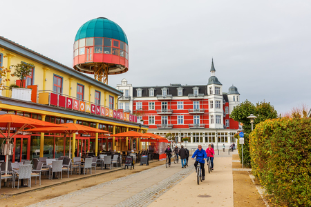 Zinnowitz, Germany - October 24, 2017: lifted cafe at the promenade with unidentified people. Zinnowitz is a baltic sea resort and one of possible sites for the mythological sunken medieval city Vinetaのeditorial素材